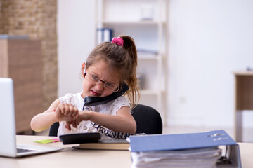 Funny small girl accountant working in the office