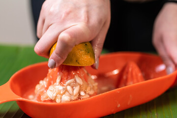 woman's hands squeezing lime juice