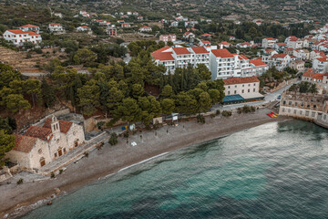 Aerial drone shot of Gusarica Beach in Komiza on Vis Island in Croatia before sunrise in early morning