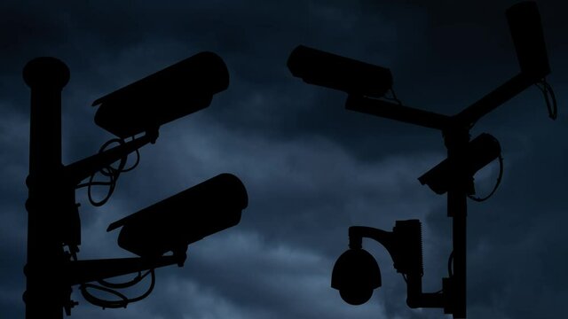Concept of surveillance and privacy: Lightning and Thunderstorm flash over Urban Security cameras