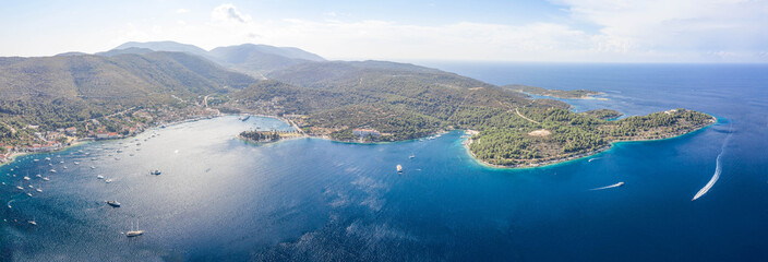 Aerial panoramic drone shot of Adriatic Coastline of Vis Island in Croatia summer
