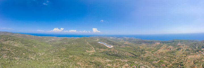 Aerial panoramic view of Vis Island Adriatic coastline horizon near Zena Glava village in Croatia summer