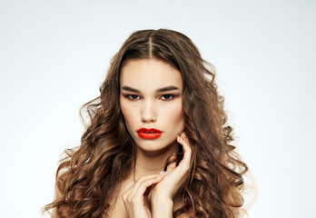 Fototapeta premium Beautiful woman red lips with eyeshadow and curly hair