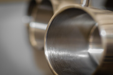 Stainless steel thermo mug with blurred background.