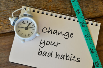 Notebook written with text CHANGE YOUR BAD HABITS.