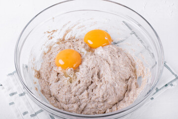 Egg yolks added to the dough. Step by step recipe of crepes with rye flour. Step 3