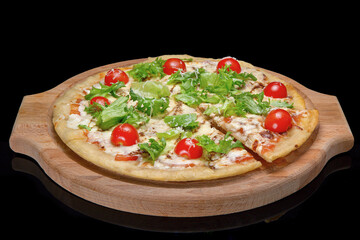 pizza on a wooden tray, black glass.