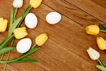 Yellow tulips white eggs Easter decoration traditions Copy Space
