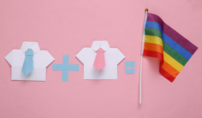 LGBT gay relationships. Equation with two male origami shirt and rainbow flag on pink background