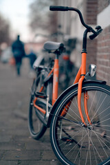 Fototapeta na wymiar orange bicycle on the street