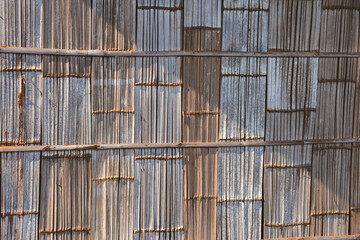 Beautiful patterned bamboo wall, hill tribe house, sunlight