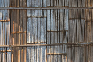Beautiful patterned bamboo wall, hill tribe house, sunlight