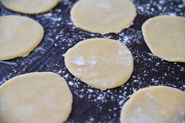 Fototapeta na wymiar An empty rounds dough with flour powder