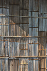 Beautiful patterned bamboo wall, hill tribe house, sunlight