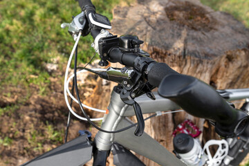 Mountain bike handlebar with hydraulic brake lever with mineral oil inside and derailleur lever.