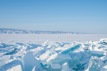 Fototapeta na wymiar Winter Baikal lake landscape with Sun on blue sky.