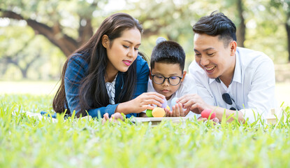 Fototapeta premium Colourful Easter eggs and family.