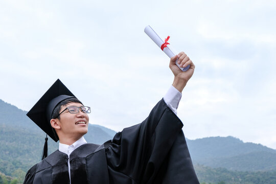 Student with congratulations, graduates wearing a graduation gown of university.