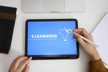 E-Learning concept with website on tablet. Education Internet Technology Webinar Online