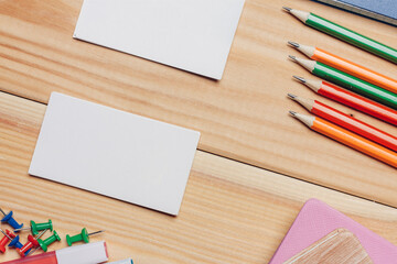 Obraz premium business cards colorful pencils work desk stationery top view