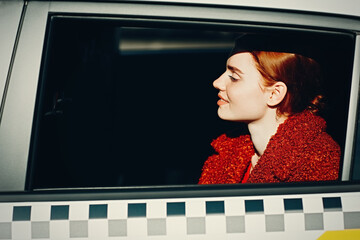 Young woman riding in taxi car on back seat © primipil