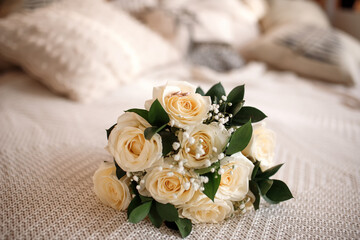 Wedding bouquet for bride on the bed