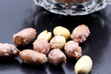 salted peanuts in a glass bowl