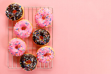 colorful donuts  on pink background