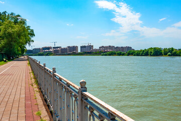 embankment Krasnodar city - pedestrian zone on embankment kuban river near Bridge of Kisses in summer time