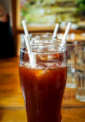 glass of special ice tea on wooden table