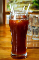 glass of special ice tea on wooden table