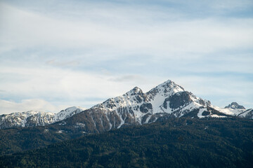 Pointed snowcap mountains behind European Alps