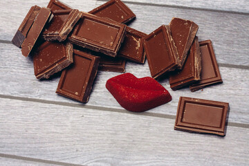 sweets milk chocolate red lips marmalade meal wooden background