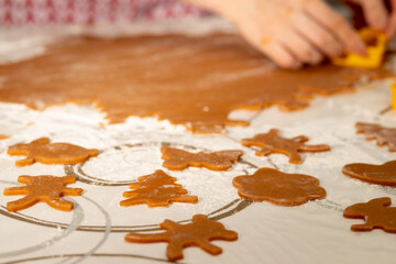 preparation of desserts. Women's hands cut out shapes for cookies