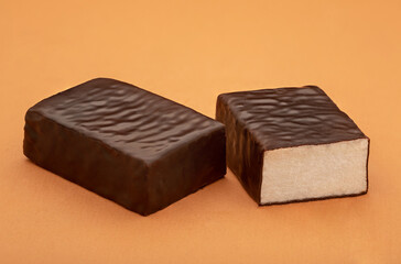 Chocolate candy on a colored background