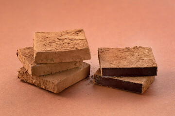 Chocolate candy on a colored background