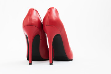 High-heeled shoes in red. Sexy shoes. White background. There is space for text