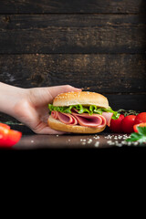 sandwich sausage and vegetables burger salami ham, lettuce, tomato snack healthy meal top view copy space for text food background rustic image