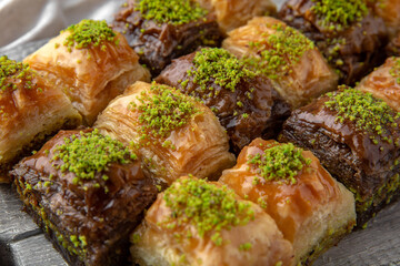 Turkish Ramadan Dessert Baklava from pistachios and walnuts. Selective focus.