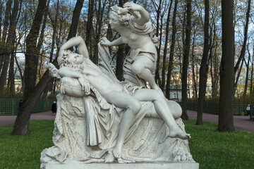Sculptural composition of the Summer Garden " Cupid and Psyche". Copy. Old Public park "Summer Garden" in St. Petersburg, Russia