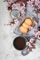 Overhead view of a single delicious breakfast with cookies and blossoms.