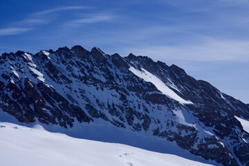 Mountain spikes of mountain peak Trugberg seen from Jungfraujoch, Switzerland. Photo taken February 26th, 2021, Jungfraujoch, Switzerland.