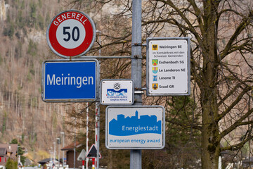 Street signs at the entrance of he village Meiringen, Switzerland.