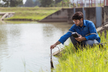 A technician using portable multi parameter water quality measurement