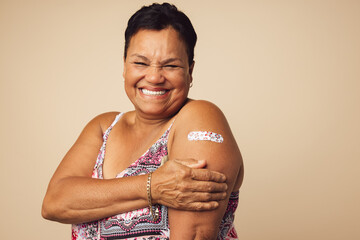 Senior woman smiling after vaccination - obrazy, fototapety, plakaty