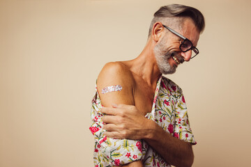 Mature man feeling relaxed after getting vaccine