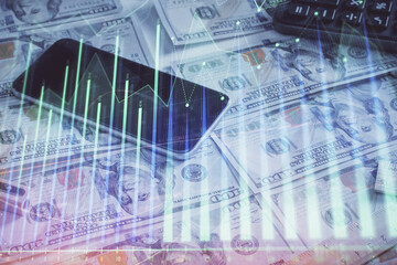 Naklejka premium Double exposure of forex graph drawing over us dollars bill background. Concept of financial markets.