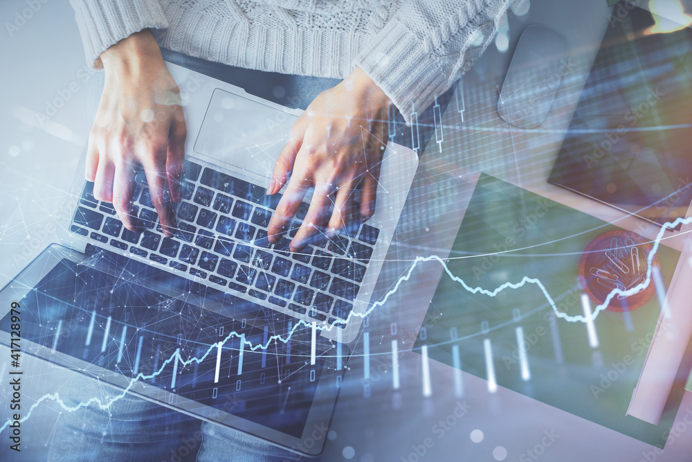 Poster double exposure of woman hands working on computer and forex chart hologram drawing. top view. finan