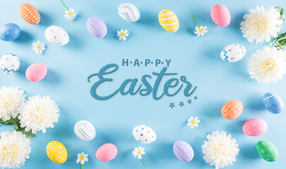 Fototapeta na wymiar Happy easter! Colourful of Easter eggs with flower on pastel blue background. Greetings and presents for Easter Day celebrate time. Flat lay ,top view.