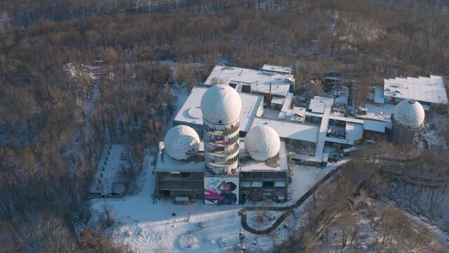 aerial view down on abandoned surveillance station in winter